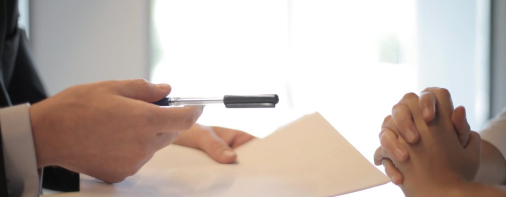 crop businessman giving contract to woman to sign